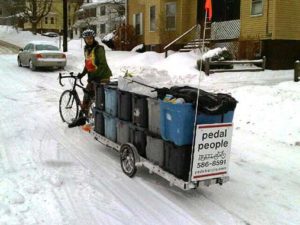 USFCW-member Pedal People hauls trash and recycling and delivers farm shares by bike in MA. Photo courtesy of Maureen Flannery.